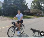 Yarislav riding a bike (!!!) on our street